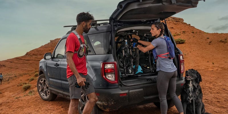 People loading equipment into the back of a 2026 Ford Bronco Sport